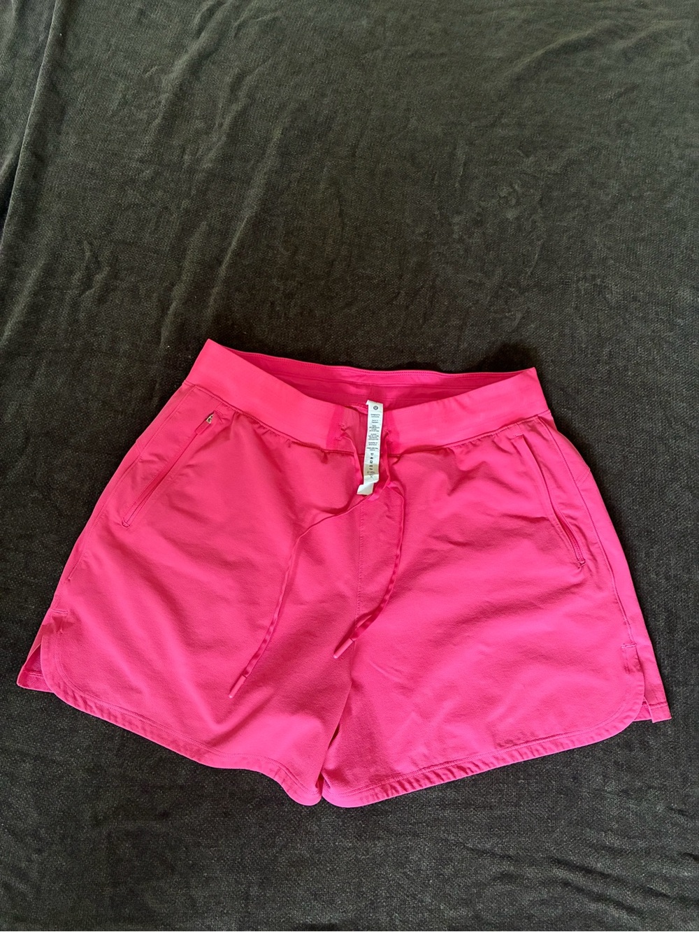 Lululemon size 10 Women’s Pink Coral Drawstring Active Shorts w zipper pockets